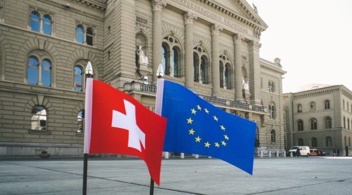 The Swiss and the EU flag near the Court of the Swiss Confederation in Bern